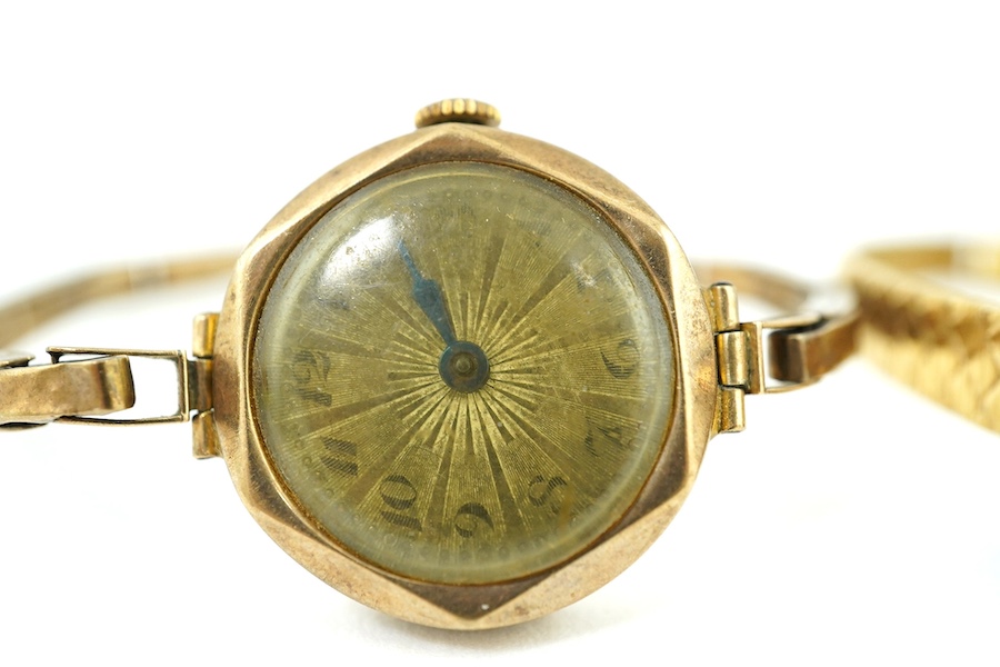 A lady's 9ct gold manual wind wrist watch, on a 9ct flexible bracelet, gross weight 17 grams and a lady's Rotary steel and gold plated wrist watch. Condition - poor to fair